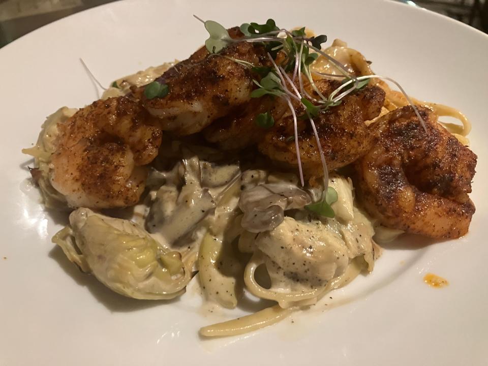 This blackened shrimp pasta is comprised of blackened jump shrimp, artichoke hearts, chardonnay cream sauce and Ohio City Pasta's fresh garlic linguine.