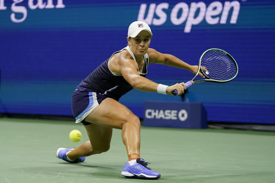 Ashleigh Barty, of Australia, returns a shot to Shelby Rogers, of the United States, during the third round of the US Open tennis championships, Saturday, Sept. 4, 2021, in New York. (AP Photo/Frank Franklin II)