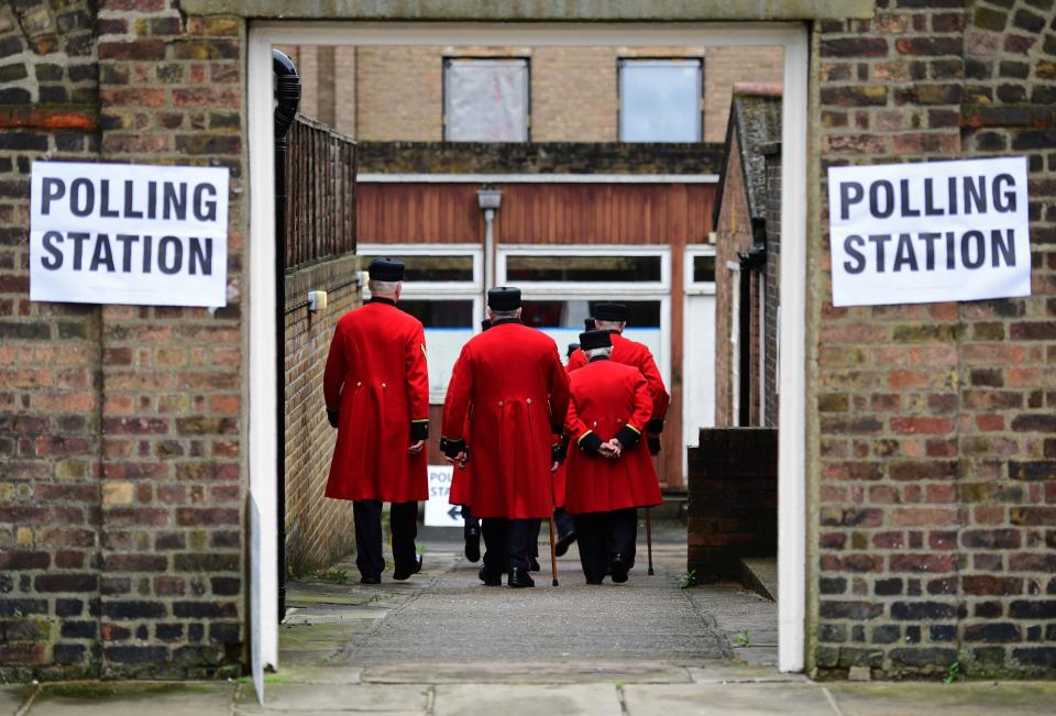 Chelsea pensioners are ushered into a polling station to cast their ballot papers at the Royal Hospital in Chelsea, west London on June 23, 2016, as Britain holds a referendum to vote on whether to remain in, or to leave the European Union (EU).&nbsp;