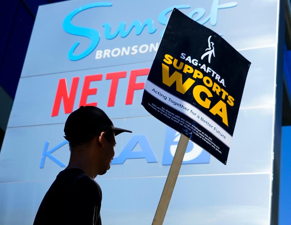 Members of the actors union, SAGA-AFTRA, and the writers union, the WGA, picket outside the offices of Netflix on July 12, 2023. SAG is officially on strike after failing to reach a contract with the Hollywood studios, the first time actors have stopped work in decades.