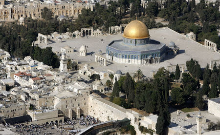 An aerial view shows the Dome of the Rock (R) on the compound known to Muslims as the Noble Sanctuary and to Jews as Temple Mount, and the Western Wall (L) in Jerusalem's Old City October 10, 2006. REUTERS/Eliana Aponte/File Photo