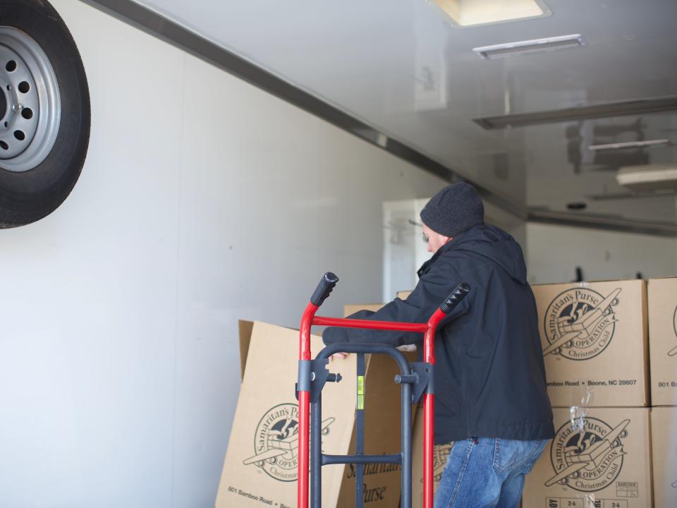 Stacked like puzzle pieces, all the boxes of shoeboxes were loaded onto the truck in a two-day packing event. Many volunteers helped out Sunday night, and a smaller group finished the job Monday morning.