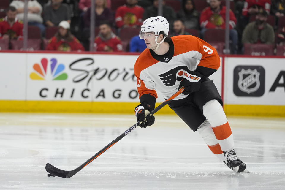 Philadelphia Flyers defenseman Jamie Drysdale handles the puck during the second period of the team's NHL hockey game against the Chicago Blackhawks, Wednesday, Feb. 21, 2024, in Chicago. (AP Photo/Erin Hooley)