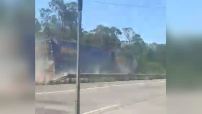 The truck slips off the highway on to a grass shoulder next to the road, ending the nail-biting rampage. Photo: Facebook