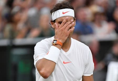 Tennis - Wimbledon - All England Lawn Tennis and Croquet Club, London, Britain - July 13, 2018 Spain's Rafael Nadal reacts during his semi final match against Serbia's Novak Djokovic . REUTERS/Toby Melville