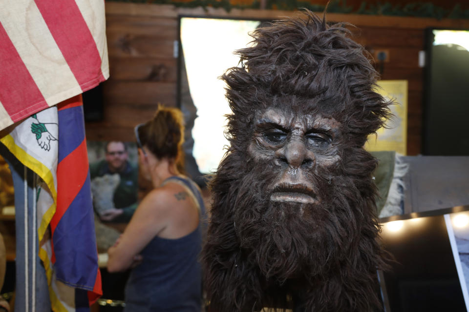 This Aug. 8, 2019, photo shows a Bigfoot mask on display at Expedition: Bigfoot! The Sasquatch Museum in Cherry Log, Ga. The owner of this intriguing piece of Americana at the southern edge of the Appalachians is David Bakara, a longtime member of the Bigfoot Field Researchers Organization who served in the Navy, drove long-haul trucks and tended bar before opening the museum in early 2016 with his wife, Malinda. (AP Photo/John Bazemore)