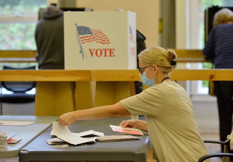 Wellfleet Town Clerk Jennifer Congel opens mail-in ballots for the primary election Tuesday at the Wellfleet Adult Community Center. To see more photos, go to www.capecodtimes.com/news/photo-galleries.