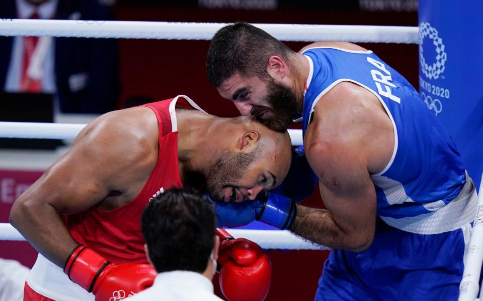 Clarke (left) said he told his opponent to 'calm down' after the bout - AP