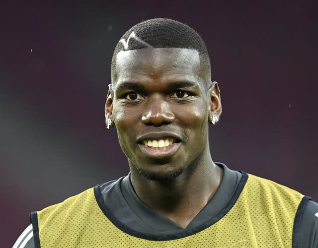 Paul Pogba is all smiles during a training session in Cologne