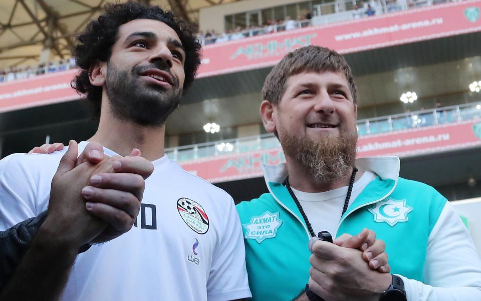 Mo Salah and Ramzan Kadyrov stand hand in hand - AFP