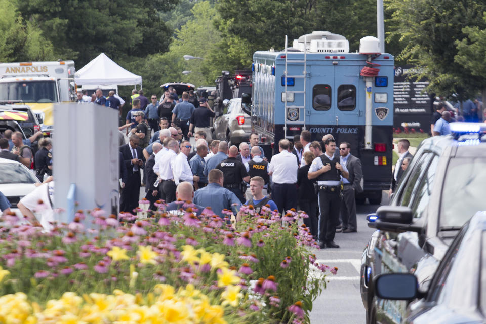 Emergency personnel congregate outside.&nbsp;