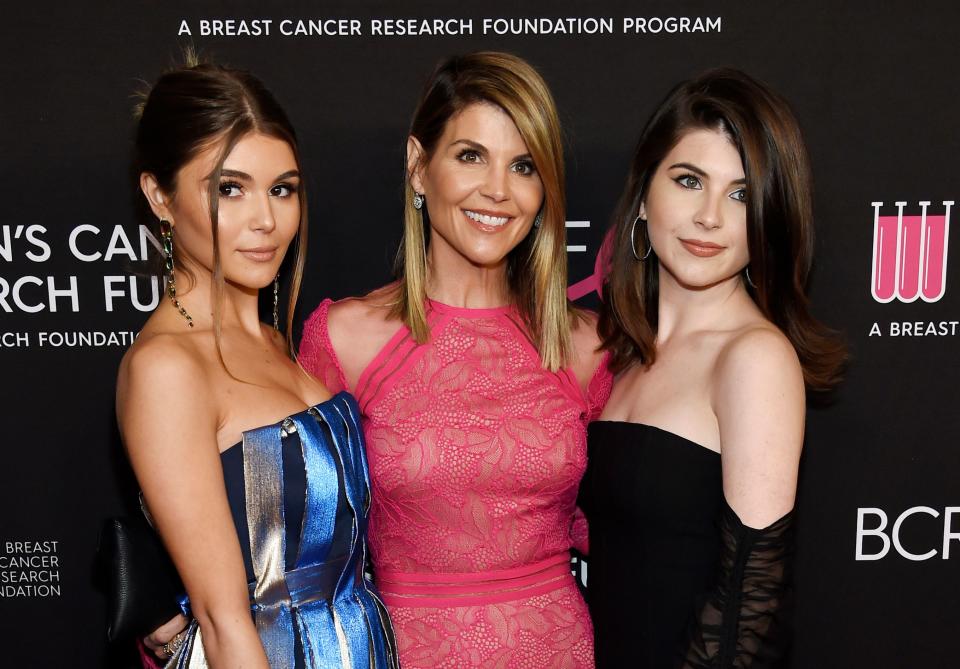 Lori Loughlin, center, poses with daughters Olivia Jade Giannulli, left, and Isabella Rose Giannulli at the 2019 "An Unforgettable Evening" in Beverly Hills, Calif.