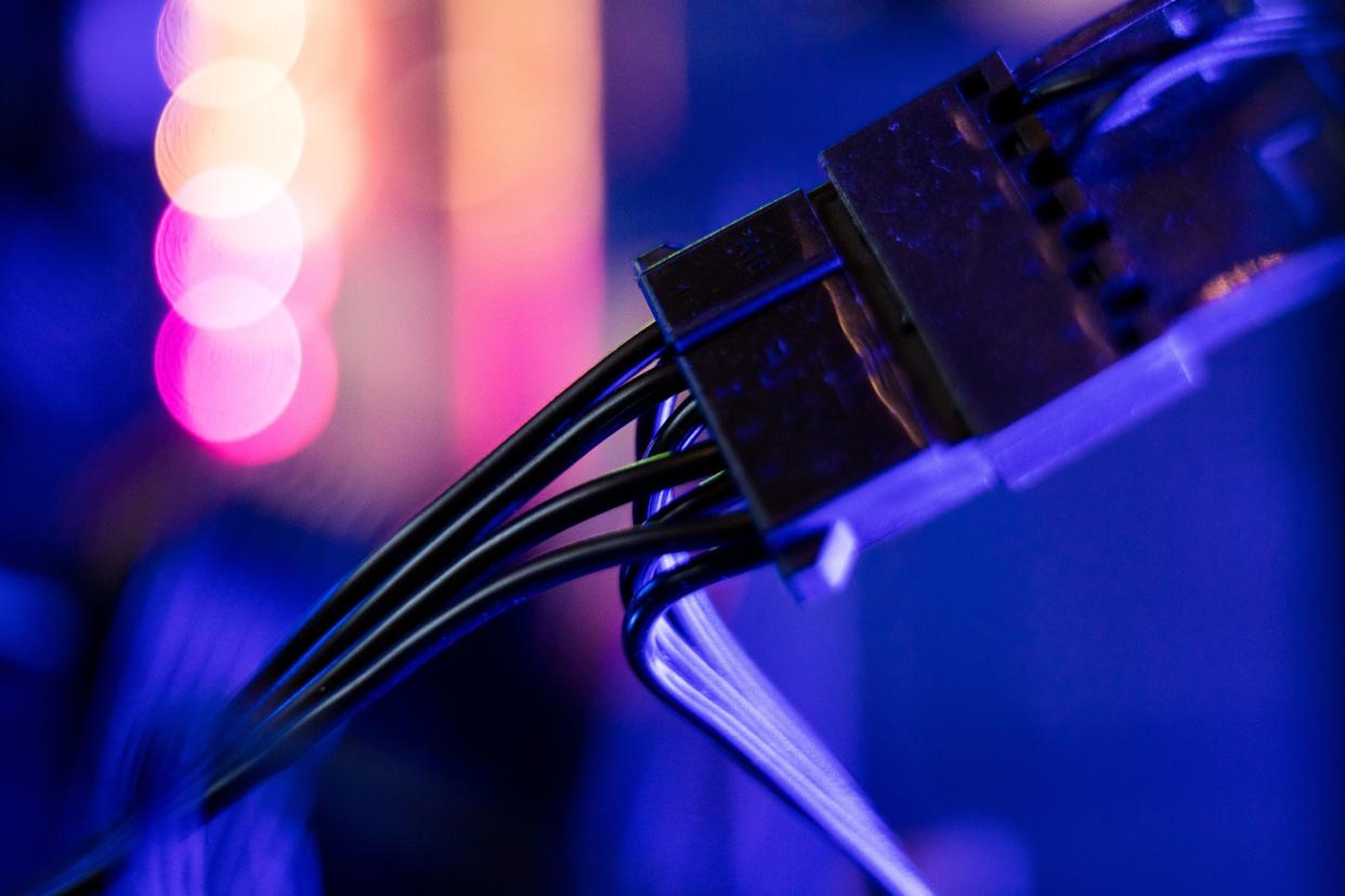 Lights illuminate a ATX power connector cables inside a 'mining rig' computer, used to mine the Electroneum cryptocurrency, in Budapest, Hungary, on Wednesday, Jan. 31, 2018. Photographer: Akos Stiller/Bloomberg