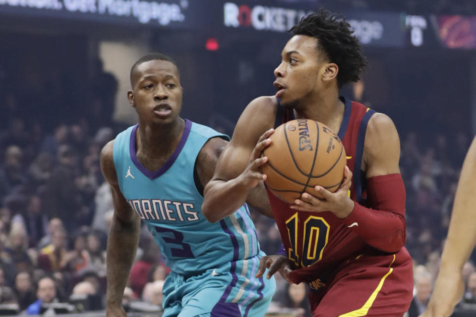 Cleveland Cavaliers' Darius Garland (10) drives past Charlotte Hornets' Terry Rozier (3) in the first half of an NBA basketball game, Thursday, Jan. 2, 2020, in Cleveland. (AP Photo/Tony Dejak)