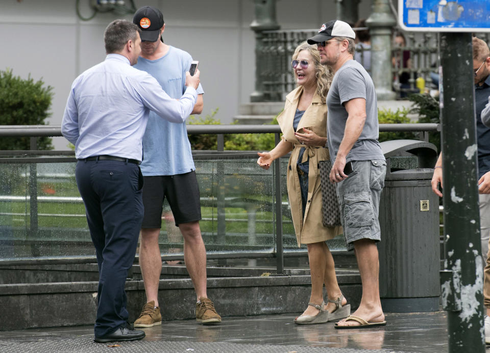 Chris Hemsworth and Matt Damon with a fan