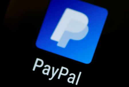 The PayPal app logo seen on a mobile phone in this illustration photo October 16, 2017. REUTERS/Thomas White/Files