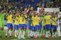 Brazil players celebrate at the end of the World Cup group G soccer match between Brazil and Switzerland, at the Stadium 974 in Doha, Qatar, Monday, Nov. 28, 2022. Brazil won 1-0. (AP Photo/Ariel Schalit)