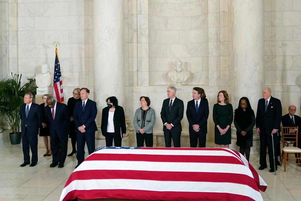 Chief Justice of the United States Supreme Court John Roberts, Justices Clarence Thomas, Samuel Alito, Sonia Sotomayor Elena Kagan, Neil Gorsuch, Brett Kavanaugh, Amy Coney Barrett, Ketanji Brown Jackson and retired Justice Anthony Kennedy, stand in front of the flag-draped casket of retired Supreme Court Justice Sandra Day O'Connor during a private service in the Great Hall at the Supreme Court on Monday in Washington, D.C.