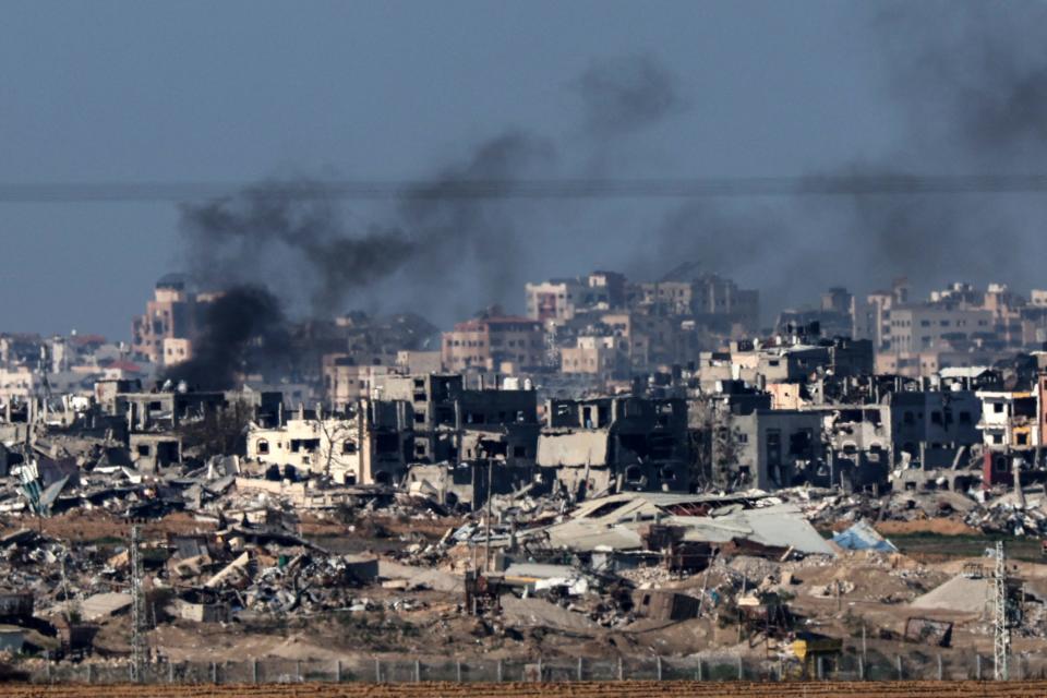 A photo taken from southern Israel on the border with the Gaza Strip shows smoke billowing over the Palestinian territory during Israeli bombardment on Jan. 25, 2024.