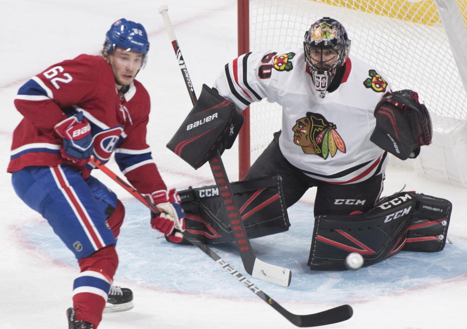 Montreal Canadiens' Artturi Lehkonen moves in on Chicago Blackhawks goaltender Corey Crawford during the second period of an NHL hockey game Wednesday, Jan. 15, 2020, in Montreal. (Graham Hughes/The Canadian Press via AP)