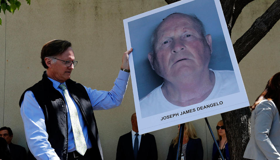 An official hold up a picture of DeAngelo at a press conference at the District Attorney Crime Lab in Sacramento, California, on April 25. Source: AAP