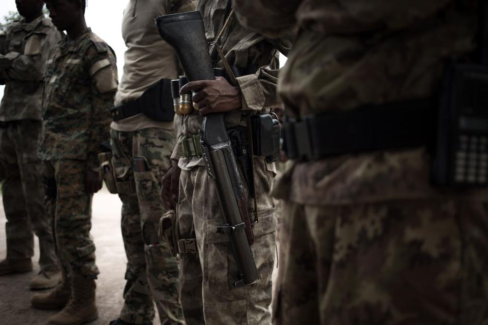 The close security guards of the Union for Peace in Central African Republic, or UPC, armed group stand in Bokolobo, near Bambari on March 16, 2019.