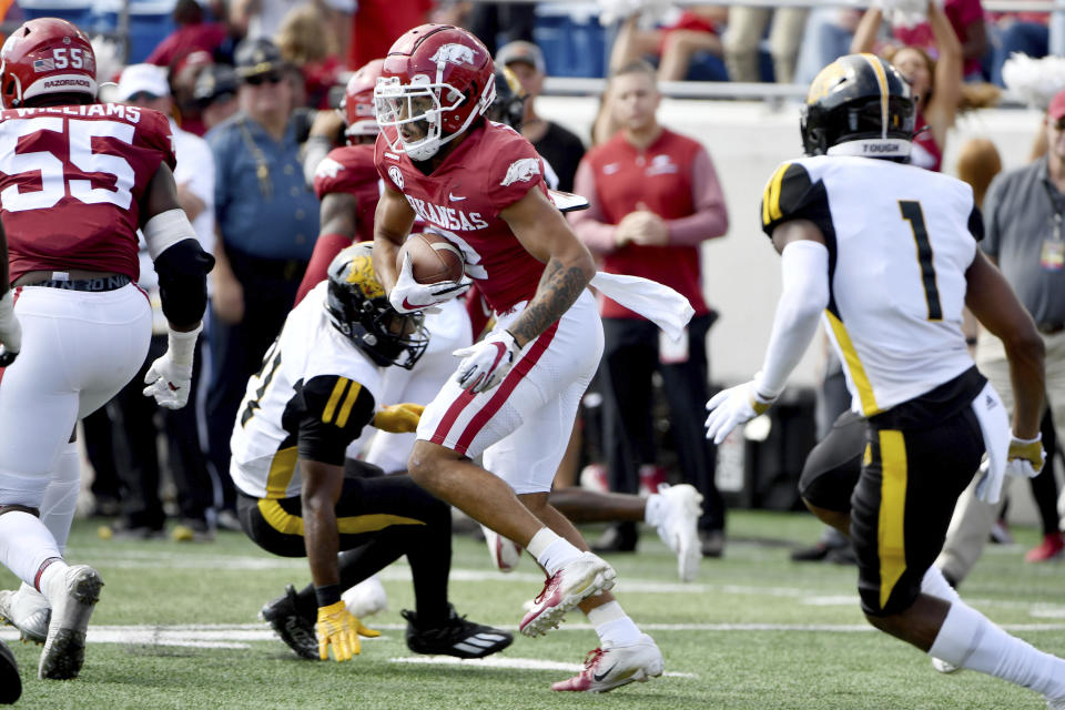 Arkansas safety Myles Slusher (2) returns an interception against Pine Bluff during the first half of an NCAA college football game Saturday, Oct. 23, 2021, in Little Rock, Ark. (AP Photo/Michael Woods)