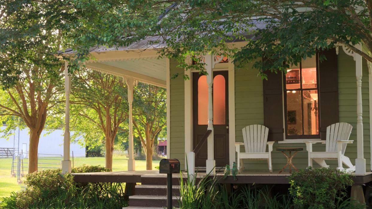  A front porch on a green painted house 