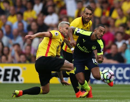 Football Soccer Britain - Watford v Arsenal - Premier League - Vicarage Road - 27/8/16 Arsenal's Theo Walcott in action with Watford's Valon Behrami Action Images via Reuters / Andrew Boyers Livepic