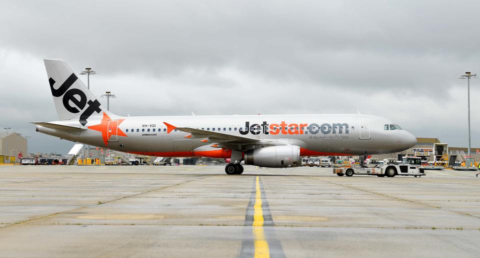 A Jetstar plane on the tarmac.