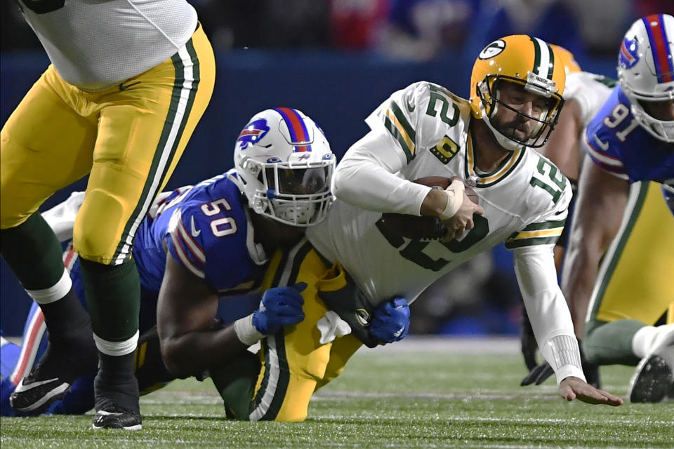 Buffalo Bills defensive end Greg Rousseau (50) sacks Green Bay Packers quarterback Aaron Rodgers (12) during the first half of an NFL football game Sunday, Oct. 30, 2022, in Orchard Park. (AP Photo/Adrian Kraus)