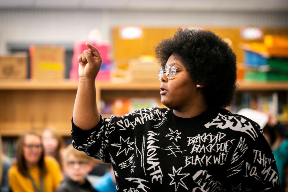 Dasia Taylor talks with fifth and sixth grade students, Tuesday, Feb. 21, 2023, at Shimek Elementary School in Iowa City, Iowa.