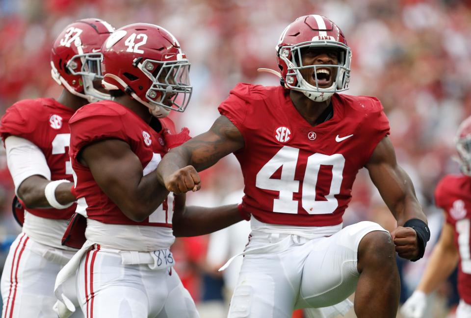 Alabama linebacker Kendrick Blackshire, right, celebrates a tackle against Ole Miss this season. A native of North Texas, Blackshire is one of two Alabama players to transfer to Texas after the retirement of Crimson Tide coach Nick Saban.