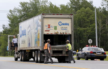 New York State Troopers search a truck at a check point near Dannemora, New York June 8, 2015. REUTERS/Chris Wattie