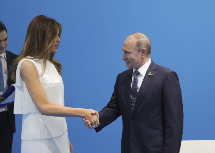 Russian President Vladimir Putin shakes hands with first lady Melania Trump during a meeting on the sidelines of the G-20 summit in Hamburg, Germany.