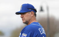 FILE - Kansas City Royals pitching coach Cal Eldred watches players warm up during a baseball spring training workout, Feb. 15, 2018, in Surprise, Ariz. Eldred and team manager Mike Matheny were fired by the Royals on Wednesday, Oct. 5, 2022, night shortly after the struggling franchise finished the season 65-97 with a listless 9-2 loss to the Cleveland Guardians. (AP Photo/Charlie Neibergall, File)