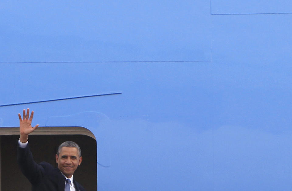 U.S. President Barack Obama waves as he boards Air Force One at the Royal Malaysian Air Force base in Subang, Malaysia, Moday, April 28, 2014 before heading to to Ninoy Aquino International Airport in Pasay, Philippines. (AP Photo/Lai Seng Sin)