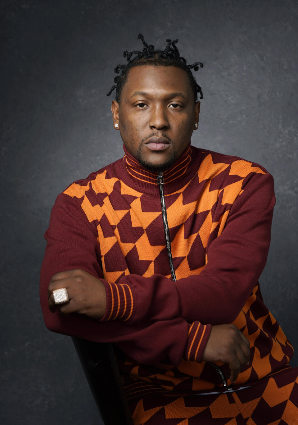 FILE - Record producer and recording artist Hit-Boy poses for a portrait, Tuesday, March 8, 2022, in Los Angeles. When Hit-Boy walks the Grammy red carpet, he expects to proudly strut into the Feb. 4, 2024 awards ceremony with his father beside him for the first time. (AP Photo/Chris Pizzello, File)