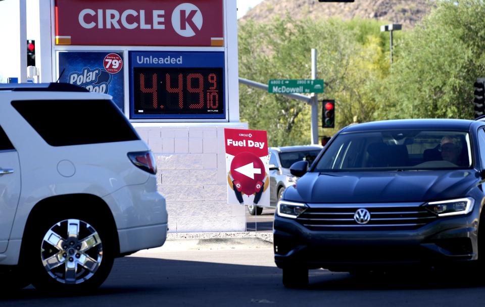 Customers wait in line to fill up on gas at Circle K at McDowell and Power roads in Mesa. Select Circle K's celebrated Fuel Day offering customers 40 cents off gas and other coupons.