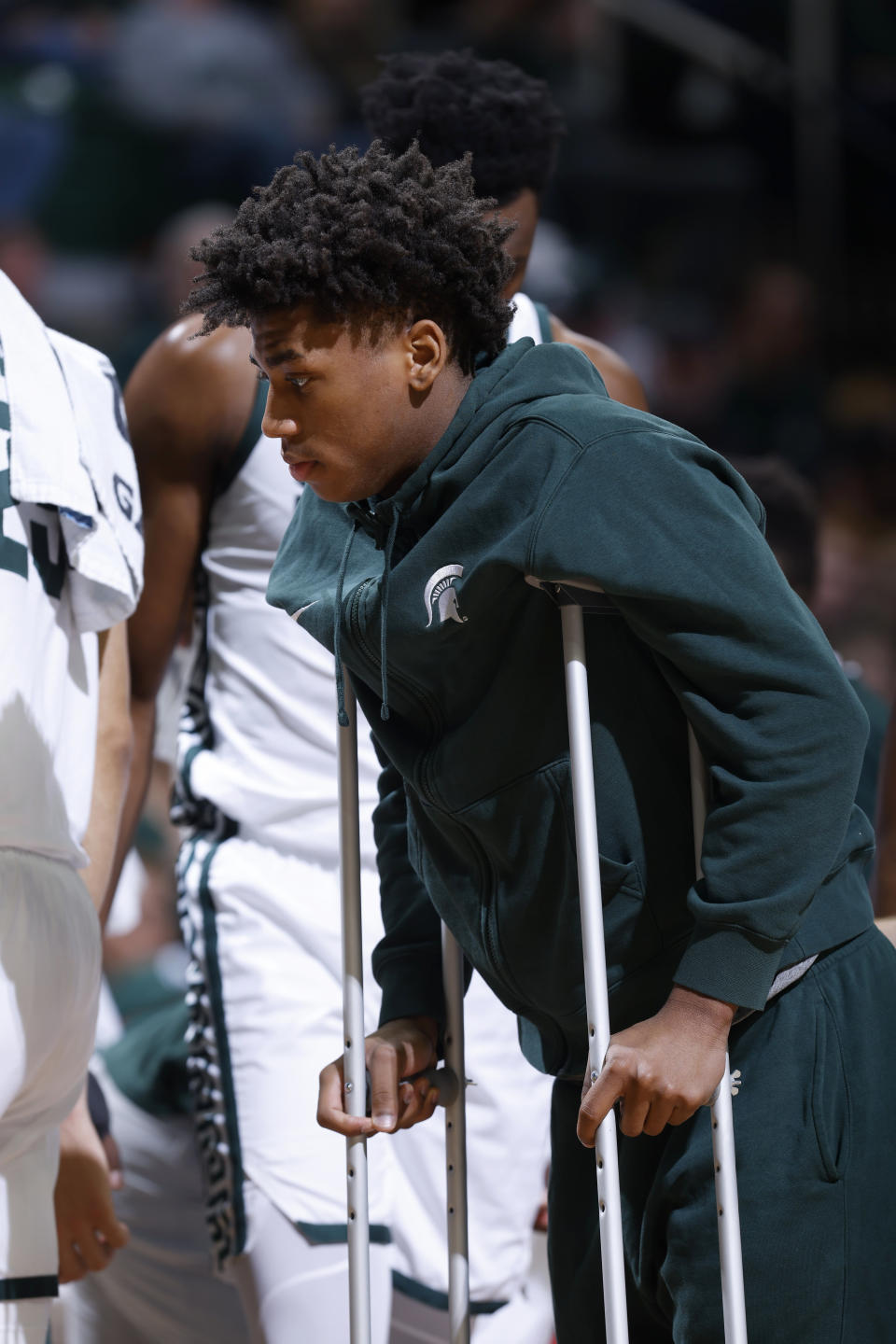 Michigan State guard Jeremy Fears Jr. walks on crutches during the first half of an NCAA college basketball game against Indiana State, Saturday, Dec. 30, 2023, in East Lansing, Mich. (AP Photo/Al Goldis)