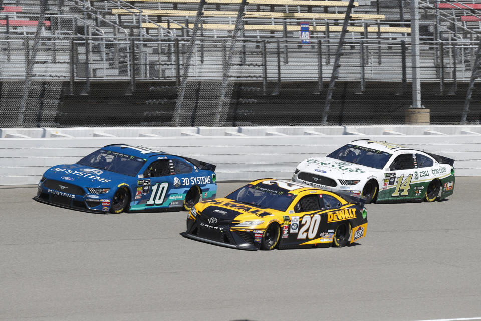 Aric Almirola (10), Erik Jones (20) and Clint Bowyer (14) practice for a NASCAR Cup Series auto race at Michigan International Speedway in Brooklyn, Mich., Saturday, Aug. 10, 2019. (AP Photo/Paul Sancya)