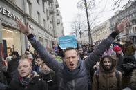 FILE - In this Sunday, Jan. 28, 2018 file photo, Russian opposition leader Alexei Navalny, center, attends a rally in Moscow, Russia. Russian opposition leader Alexei Navalny was the victim of an attack and poisoned with the Soviet-era nerve agent Novichok, the German government said Wednesday, Sept. 2, 2020 citing new test results. Navalny, a politician and corruption investigator who is one of Russian President Vladimir Putin's fiercest critics, fell ill on a flight back to Moscow from Siberia on Aug 20 and was taken to a hospital in the Siberian city of Omsk after the plane made an emergency landing. (AP Photo/Evgeny Feldman, File)