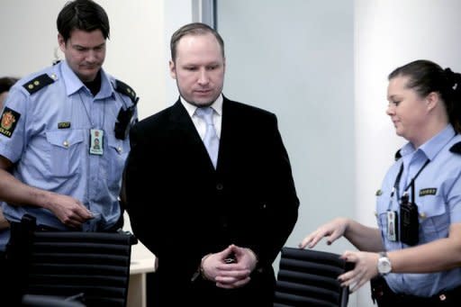 Mass killer Anders Behring Breivik wears a dark suit with white shirt and light blue tie as prosecutors give their summing up of the case against him in Oslo on Thursday