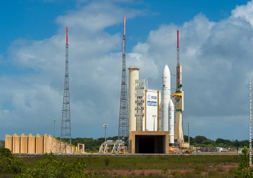 An Ariane 5 rocket stands on the launchpad at the Guiana Space Center in Kourou, French Guiana, on Feb. 4, 2019. The rocket is scheduled to launch two communications satellites for Saudi Arabia and India on Feb. 5. <cite>Arianespace </cite>