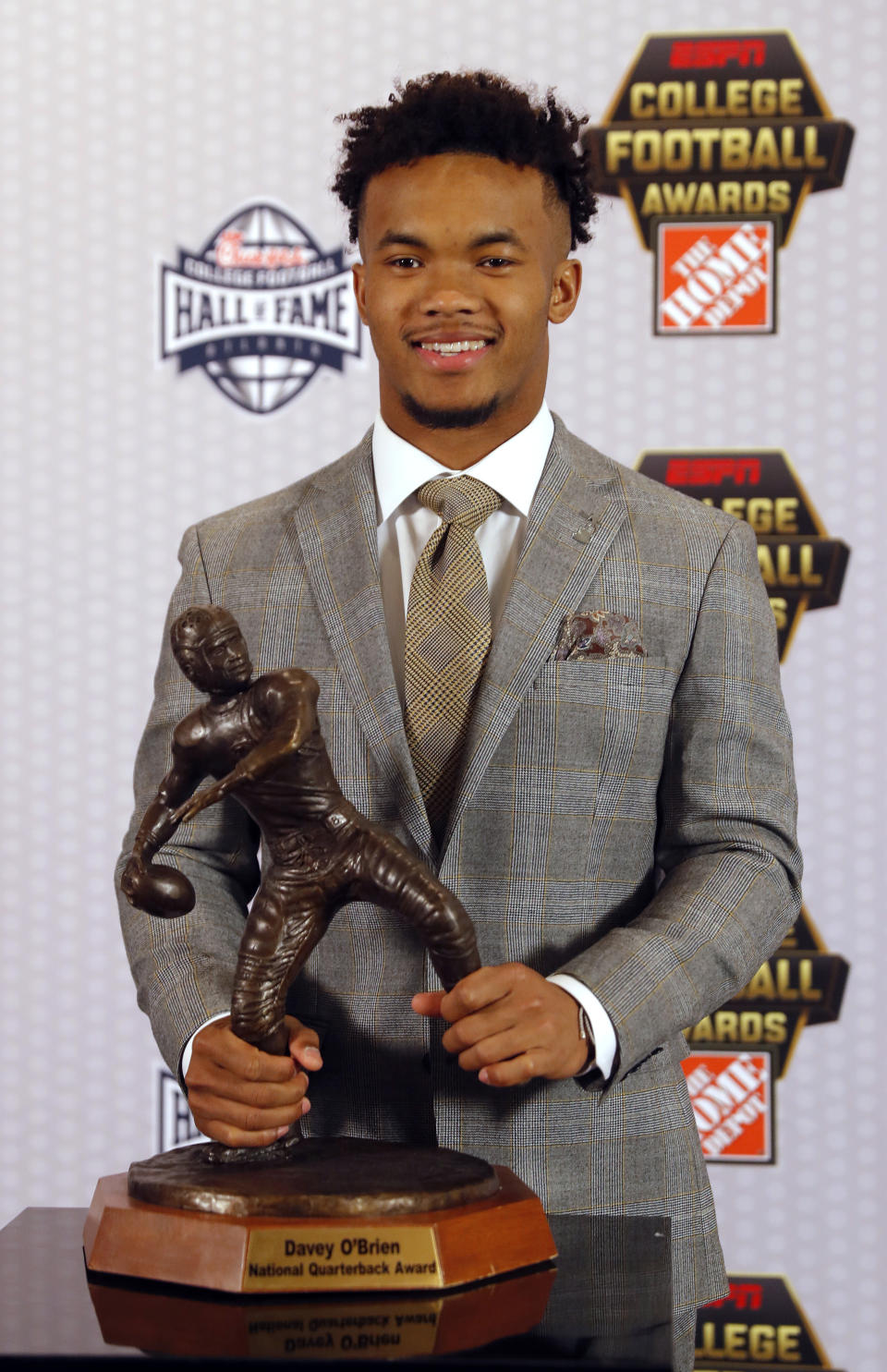 Oklahoma quarterback Kyler Murray poses with the trophy after winning The Davey O'Brien Award for being the top quarterback in college football, Thursday, Dec. 6, 2018, in Atlanta. (AP Photo/John Bazemore)