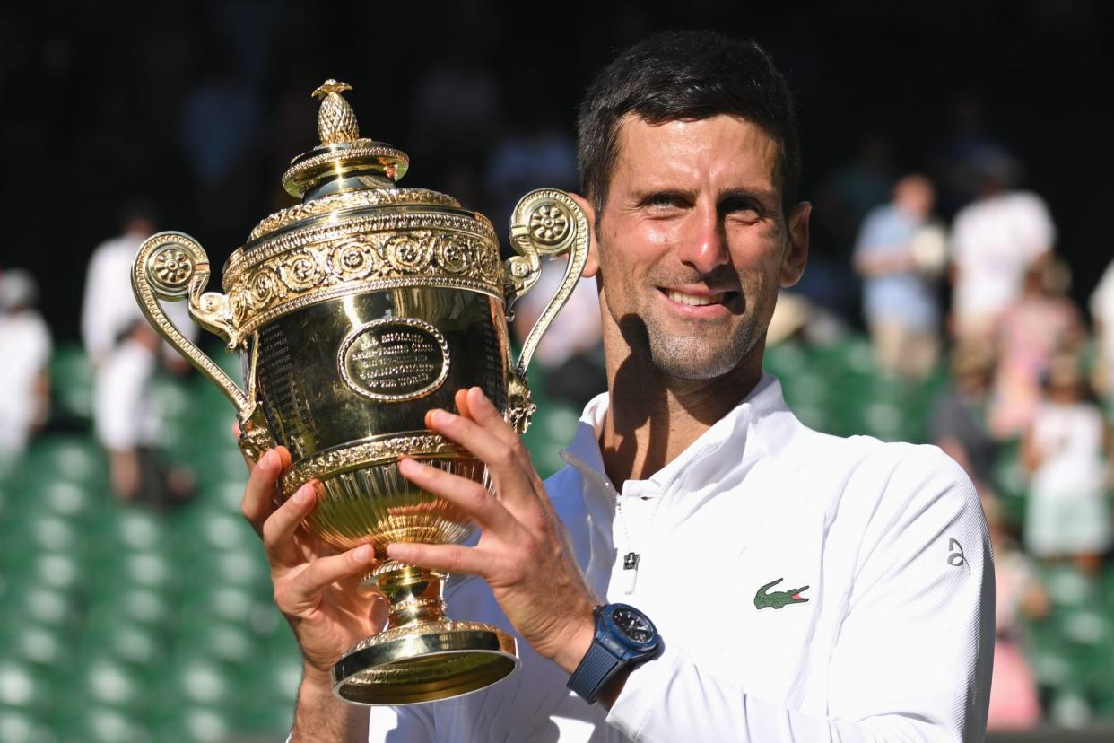 LONDON, ENGLAND - JULY 10: Novak Djokovic holds the Wimbledon Trophy after winning the Wimbledon Men's Singles Final at the All England Lawn Tennis and Croquet Club on July 10, 2022 in London, England. (Photo by Karwai Tang/WireImage)