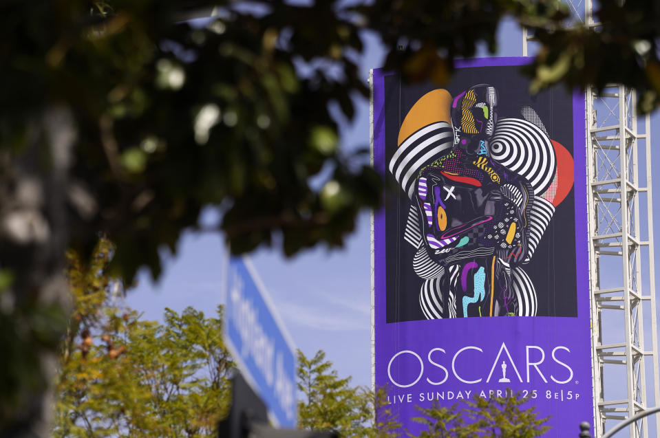 A sign advertising this year's Oscars ceremony is pictured near the Dolby Theatre, Thursday, April 15, 2021, in Los Angeles. The Dolby Theatre is one of the locations being used for the 93rd Academy Awards on Sunday, April 25. (AP Photo/Chris Pizzello)