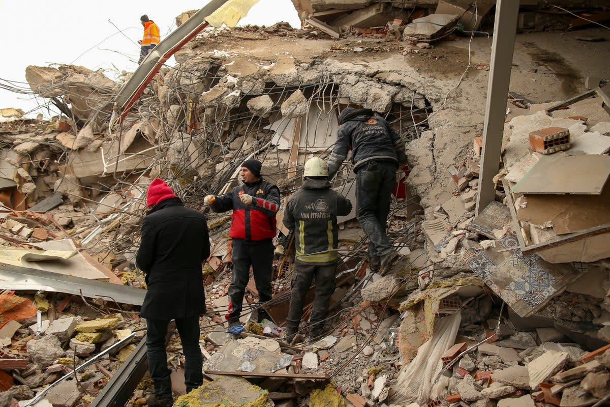 Rescue workers search for survivors on a collapsed building in Malatya, Turkey, Tuesday, Feb. 7, 2023. (AP)