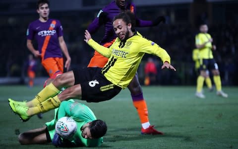 Arijanet Muric of Manchester City saves a shot from Marcus Myers-Harness of Burton Albion during the Carabao Cup Semi Final Second Leg match between Burton Albion and Manchester City  - Credit: Mark Thompson/Getty Images