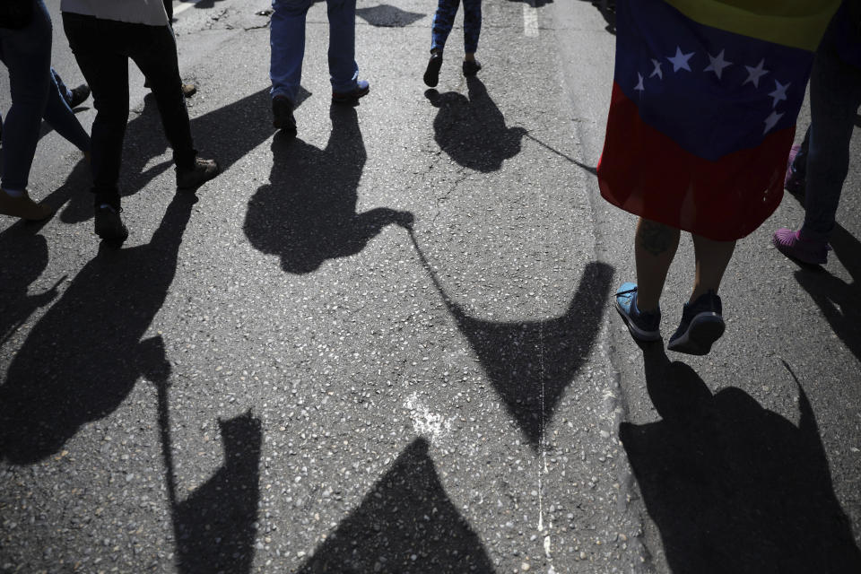 Anti-government protesters gather for the start of a nationwide demonstration demanding the resignation of President Nicolas Maduro, in Caracas, Venezuela, Saturday, Feb. 2, 2019. Momentum is growing for Venezuela's opposition movement led by lawmaker Juan Guaido, who has called supporters back into the streets for nationwide protests Saturday, escalating pressure on embattled Maduro to step down. (AP Photo/Rodrigo Abd)